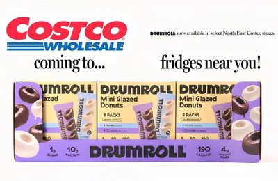 A Costco Wholesale in-warehouse announcement for a protein donut brand arriving in refrigerators at select Northeast stores.